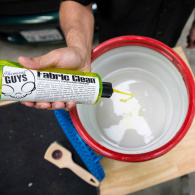 Pouring Chemical Guys Fabric Cleaner into Bucket thumbnail